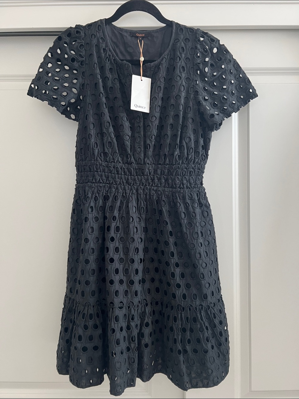 Quince Black Eyelet Short-Sleeve Dress with Smocked Waist and pockets.